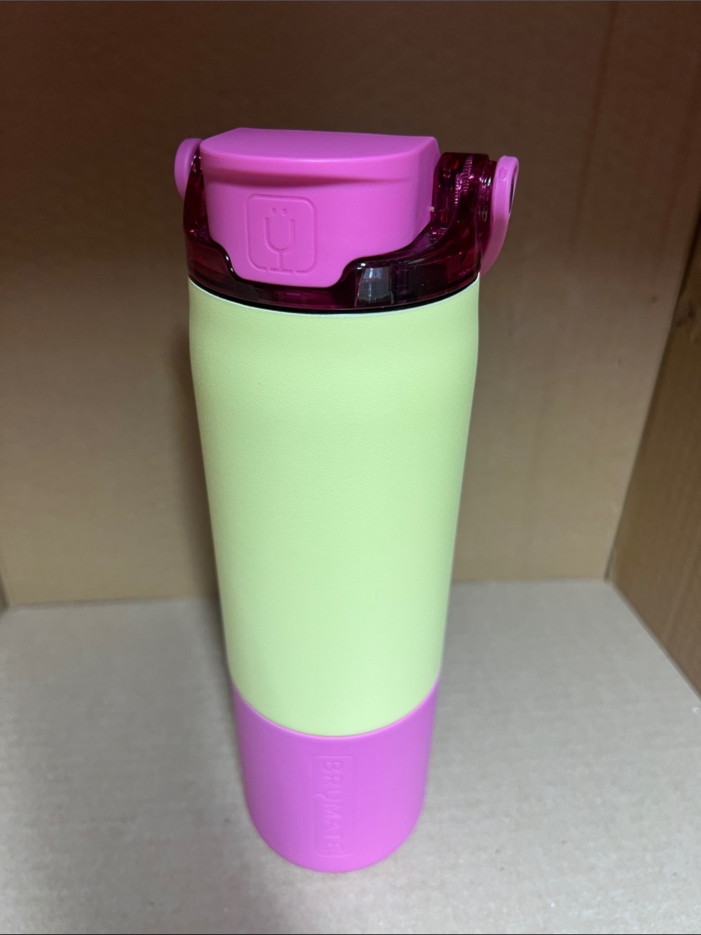 Brumate 25oz Rise Water Bottle in Prickly Pear with a Hibiscus boot and lid.